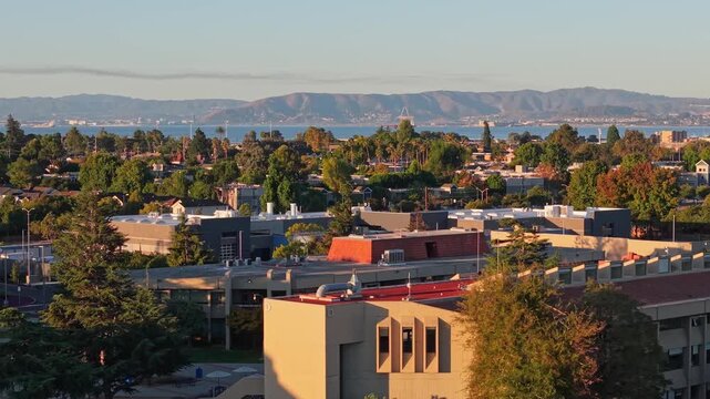 Early morning light reflects across the College of Alameda in a peaceful sunrise drone composition.
