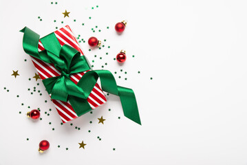 Merry Christmas and Happy Holidays greeting card, frame, banner. New Year. Red green Christmas decoration and gifts, presents on white background top view. Xmas holiday festive theme.