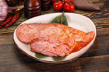 Raw marinated duck breast for cooking