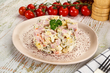 Russian traditional Olivier salad with sausages
