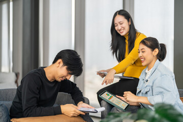 Asian tech team meeting on software project, mentor guiding coworker on tablet, teamwork development using collaboration tools, modern technology, app design, dev training and enterprise SaaS team