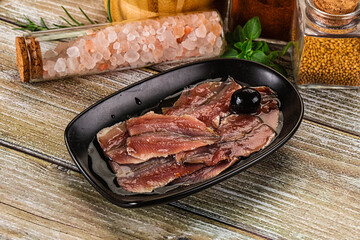 Canned anchovy with oil in the bowl