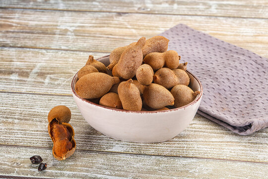 Tropical exotic Tamarind fruit heap