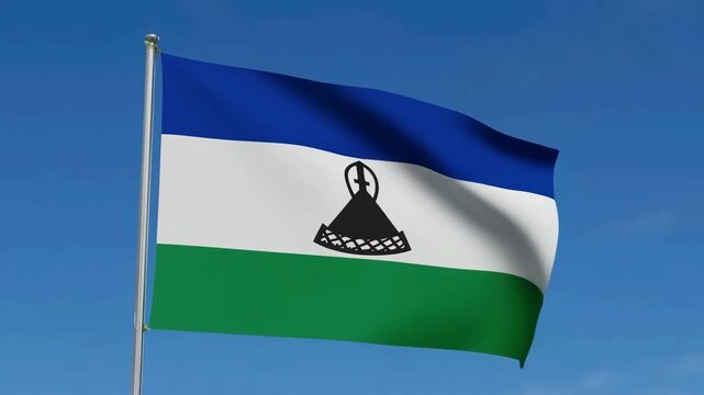 Lesotho national flag waving against blue sky - Powered by Adobe