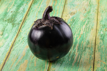 Raw round black big eggplant