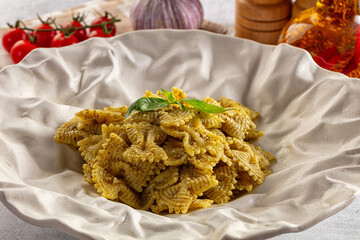 Italian green pasta farfalle with pesto