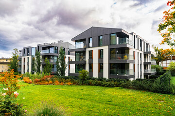 New modern residential block buildings and autumn park. Housing development in Europe	