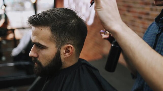 Professional barber precisely trimming a man's haircut with straight razor and shaping his hairline at a traditional barbershop, ensuring a clean and sharp look with grooming tools