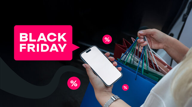 Black Friday shopping with smartphone and colorful shopping bags