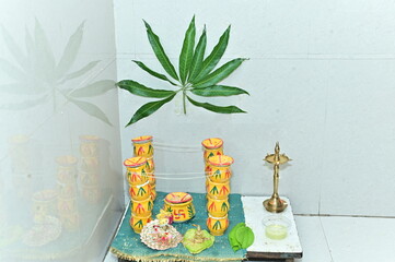 Gaurihar Pooja. Bridal wedding pooja. Marathi bride worship elements. Baby Krishna and Anapurna goddess. Maharashtra culture. Maharashtra wedding rituals. Green leaf 	