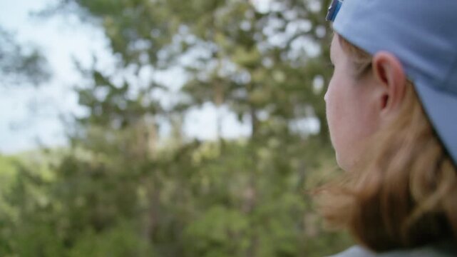 Woman in Cap Breathing Deeply and Looking and Enjoying Nature Walk