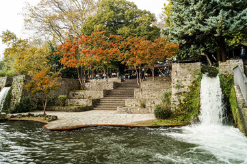 Stone steps surrounded by autumn trees in a park area of Edessa, Greece.