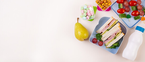 Healthy School Lunch Box with Sandwich and Fruit. Banner
