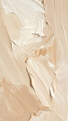 Abstract close-up of beige and cream paint strokes, creating textured surface