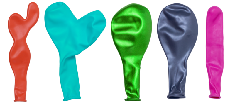 Isolated collection of multi-colored uninflated balloons on a white background