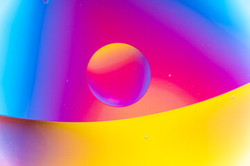 Vibrant Macro Abstract with Fluid Bubbles in Blue, Magenta, and Yellow