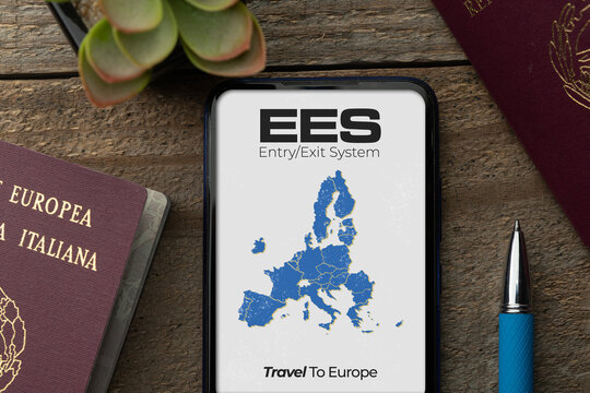 EES entry exit system concept: two passports on a wooden table