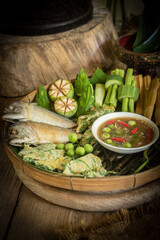Thai shrimp paste chili dip with fried mackerel and boiled vegetables, traditional Thai food still life