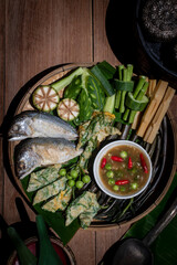 Thai shrimp paste chili dip with fried mackerel and boiled vegetables, traditional Thai food still life