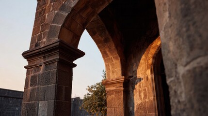 Obraz premium Stone archway basking in golden twilight whispers history's tales, enchanting Dia de los Muertos eve, Mexican cultural tapestry