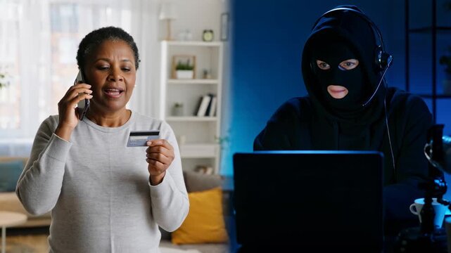  African-American woman holding credit card and talking on phone with scammer at home, senior female victim of online crime, cyber fraud and internet financial scam concept