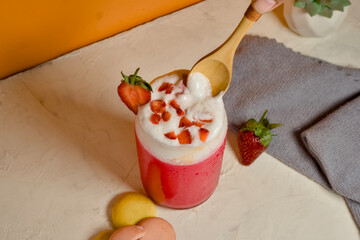 Delicious strawberry juice with whipped cream and fresh strawberries.