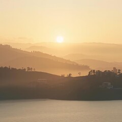 Golden sunset over rolling hills and calm water