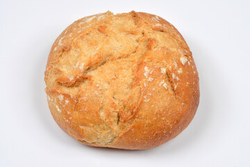 A single rustic bread roll with a cracked crust and light flour dusting is isolated on a plain white background