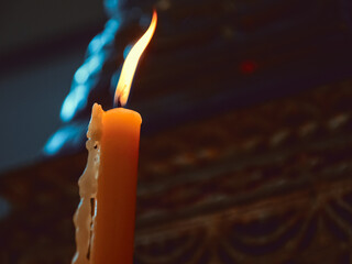 soft focus of lighting candle vigil in darkness seeking hope, worship, prayer