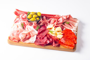 Charcuterie board. Antipasti appetizers of meat and cheese platter with salami, prosciutto crudo or jamon and olives