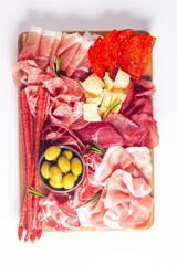 Charcuterie board. Antipasti appetizers of meat and cheese platter with salami, prosciutto crudo or jamon and olives