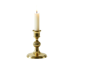 Isolated lit candle in ornate gold candlestick, vintage design and glowing warm light