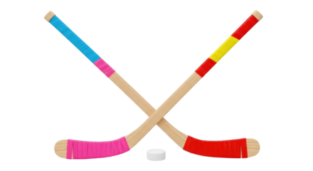 Isolated pair of colorful taped wood hockey sticks with puck for kids playing in winter game