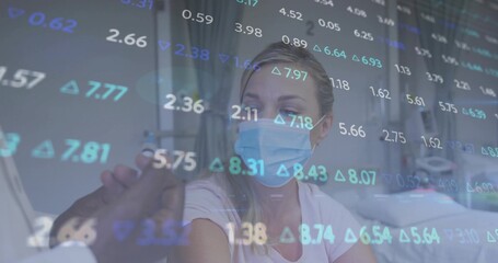 Sitting patient wearing mask getting vaccine shot in clinic, with syringe, gloves and data overlay