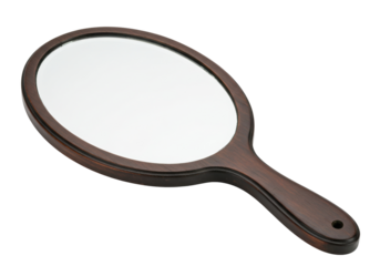 Isolated hand mirror in a brown wooden frame for makeup and cosmetic touch ups on the go