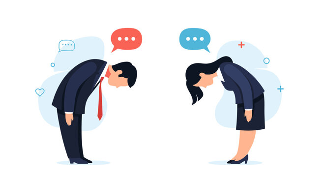 Business professionals bowing to each other in a gesture of respect and politeness.