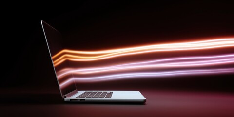 Laptop with glowing light streaks: modern technology and digital innovation concept