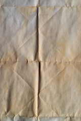 Vertical folded old paper background. Vintage vertical paper sheet with folds and aged tone. Ideal for retro and natural-style graphic use.