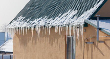 A house with icicles hanging from the roof