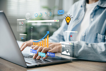 Woman using laptop to monitor online advertising metrics through a digital dashboard.