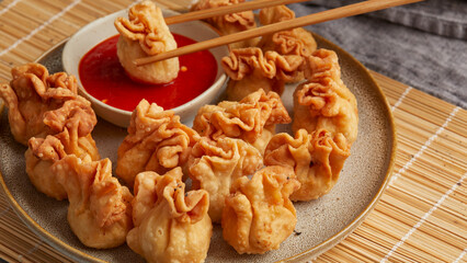 Wontons with cashew and carrot filling