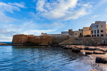 beautiful blue landscape of sea coast embarkment in a city with beach and mediterraneran buildings...