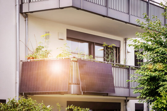 Balcony Solar Panels of Apartment Building. Mini Solar Installation Ecoflow on Balcony. Modern BALCONY SOLAR SYSTEM with Sun Reflection.