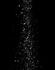 An abstract black background with a vertical cascade of white specks, evoking movement and light