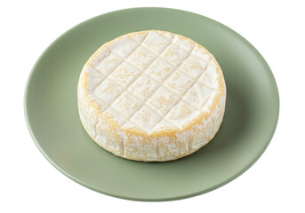 Isolated creamy Camembert cheese on green plate, French cuisine, delicious and fresh, studio shot