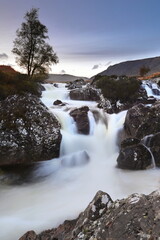 River Coupall falls in the Glen Etive valley in the autumn, seen to the south under a partly cloudy sky at sunset. Argyll Highlands-Scotland-UK-003