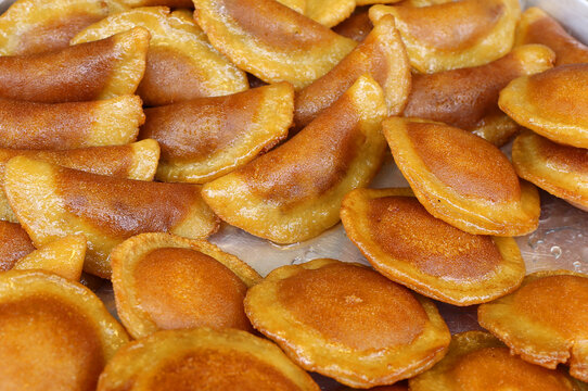Bunch of  Qatayef, Kataif aka Tas Kadayif Tatlisi desserts ready to eat at The Taste of Adana Festival in Adana, Turkey