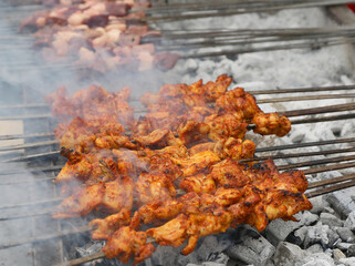 Spicy Chicken and Liver Kebabs cooking on Charcoal Grill at The Taste of Adana Festival in Adana, Turkey
