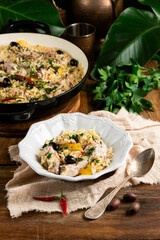 A hearty skillet dish featuring creamy chicken, orzo pasta, olives, and colorful peppers, finished with fresh parsley. Perfect for family dinners, comfort food, and quick weeknight meals.