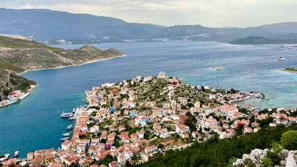 View from above of the town on Kastellorizo (Megisti) Island, Greece. Greek island travel, Mediterranean vacation, scenic landscape, summer tourism, traditional architecture, coastal town. 